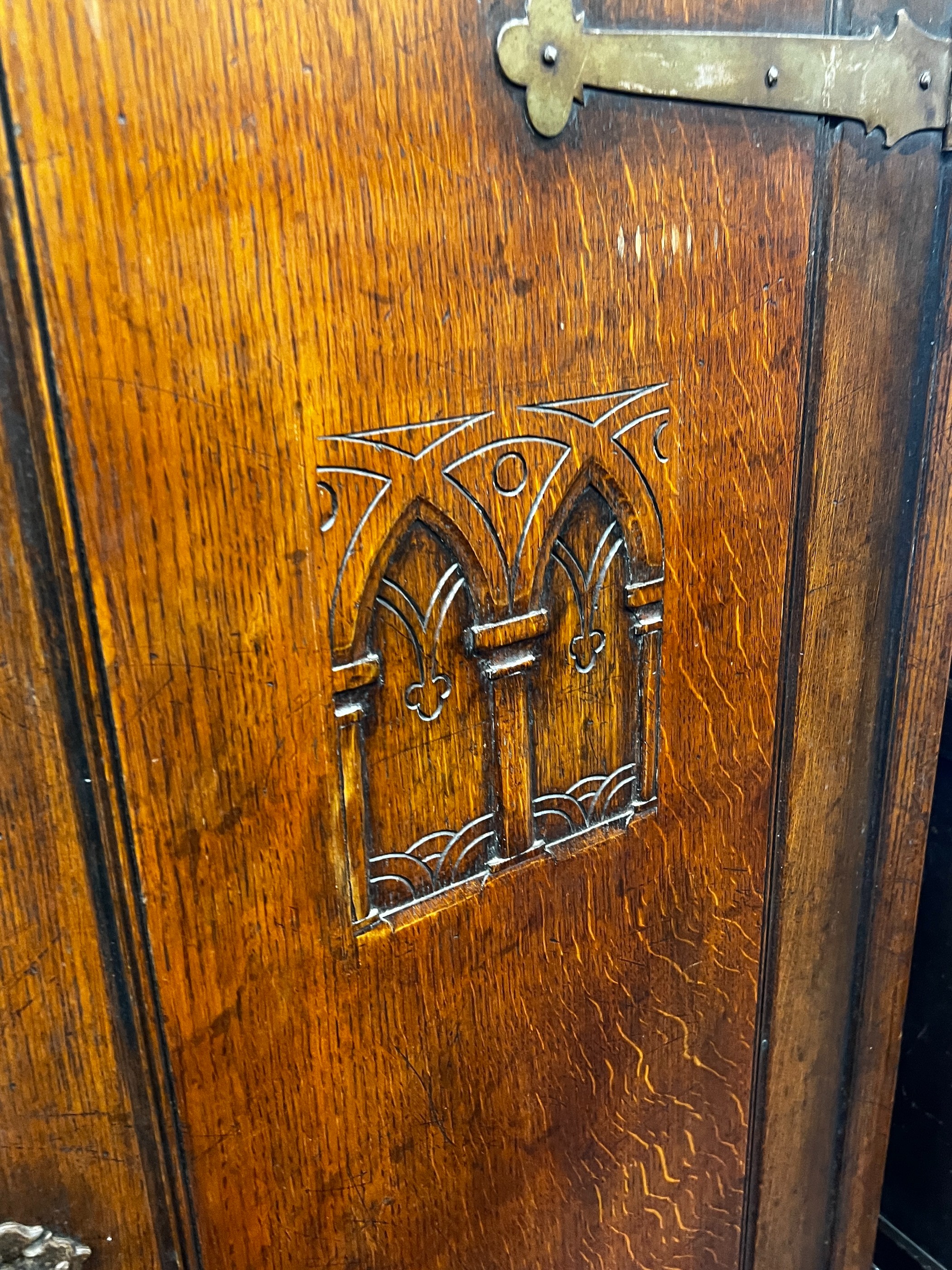 A 17th century style carved oak hall cupboard, width 76cm, depth 46cm, height 167cm
